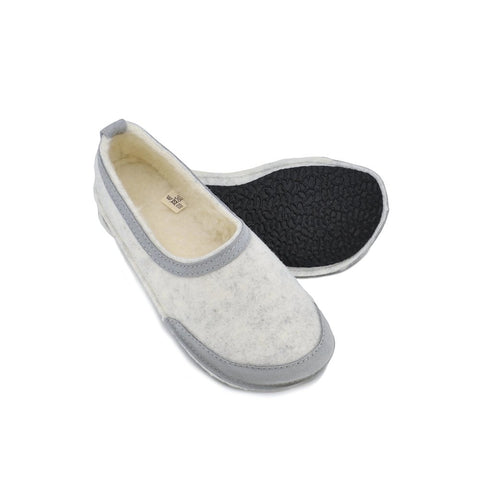 3. Omaking barefoot indoor slippers showing flexible rubber sole and lambswool insole, angled view