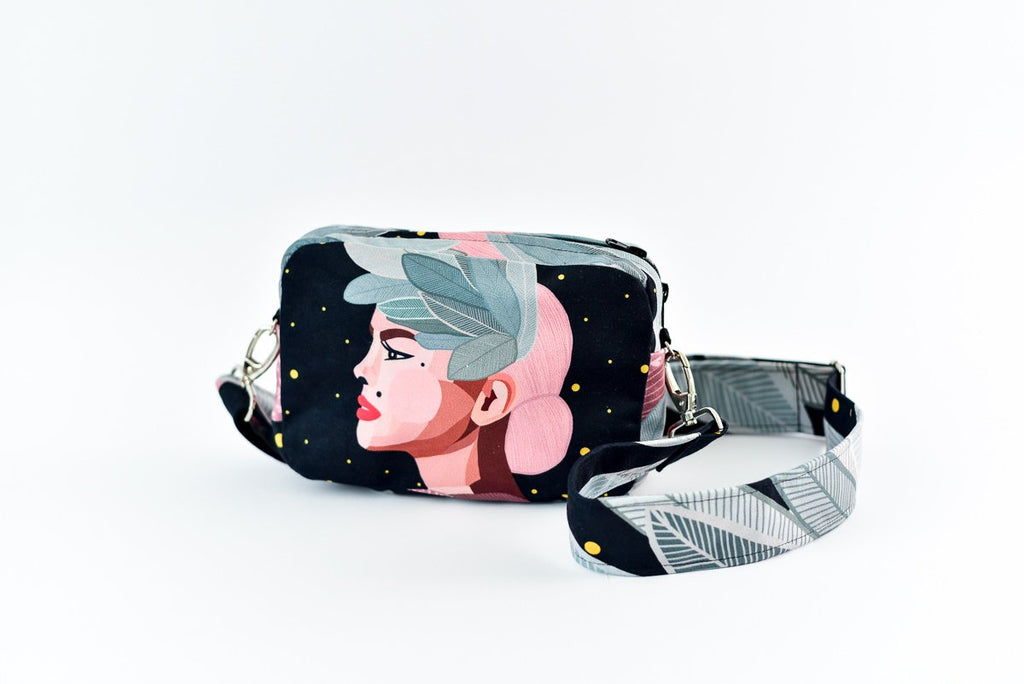 2. Garbanota Valerie shoulder bag with wide strap, featuring exclusive illustration, shown in studio setting