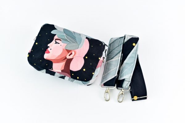 4. Close-up of Garbanota Valerie shoulder bag and detachable wide strap, highlighting exclusive illustration