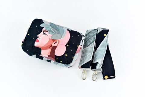 4. Close-up of Garbanota Valerie shoulder bag and detachable wide strap, highlighting exclusive illustration