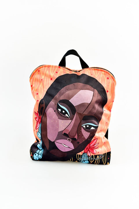 3. Studio image of Garbanota BACKPACK SADE featuring artistic face design on polyester fabric