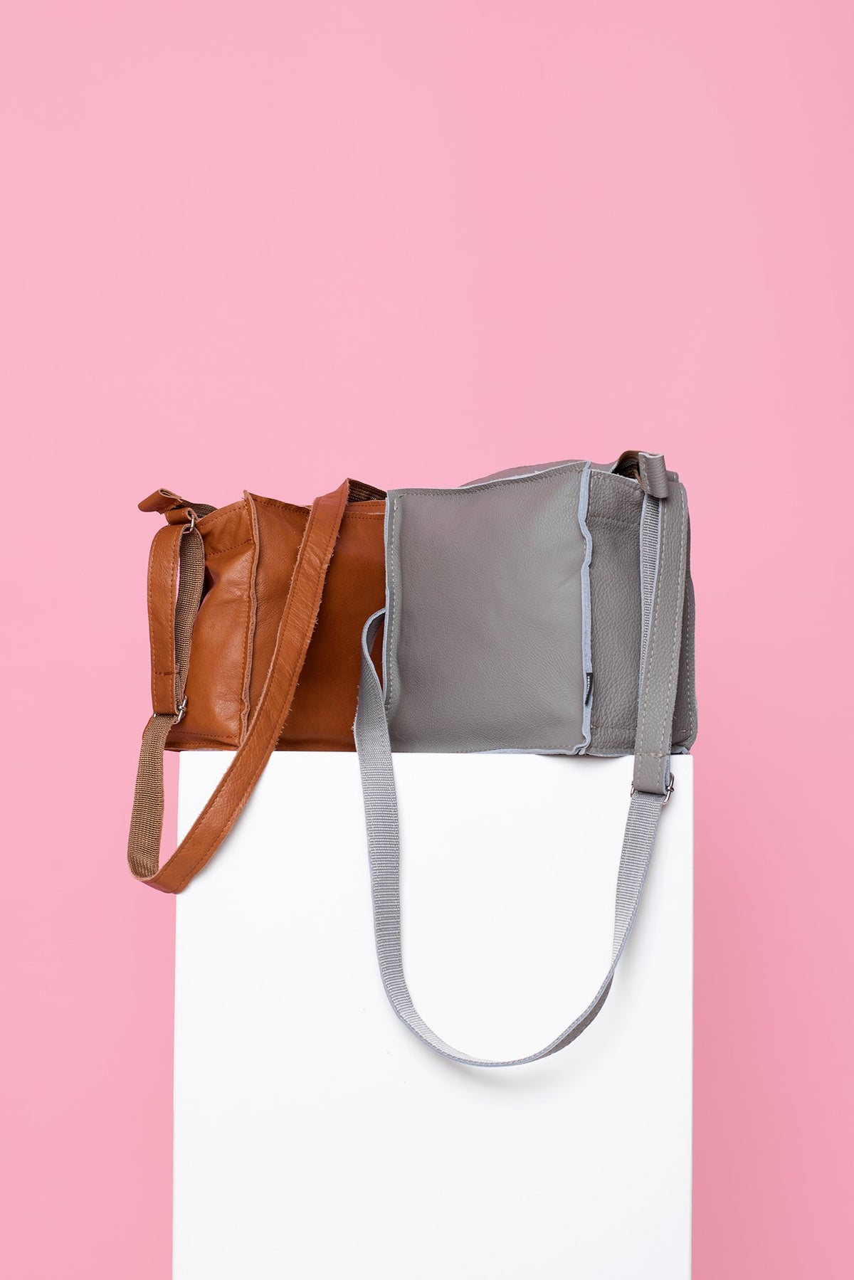 8. Light grey and brown Folk 1 shoulder bags by Trendbag on pedestal, showcasing sustainable craftsmanship