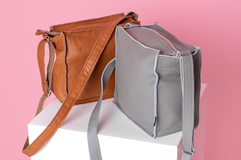 1. Trendbag Folk 1 shoulder bag in peanut and gray, displayed on a white pedestal with pink background