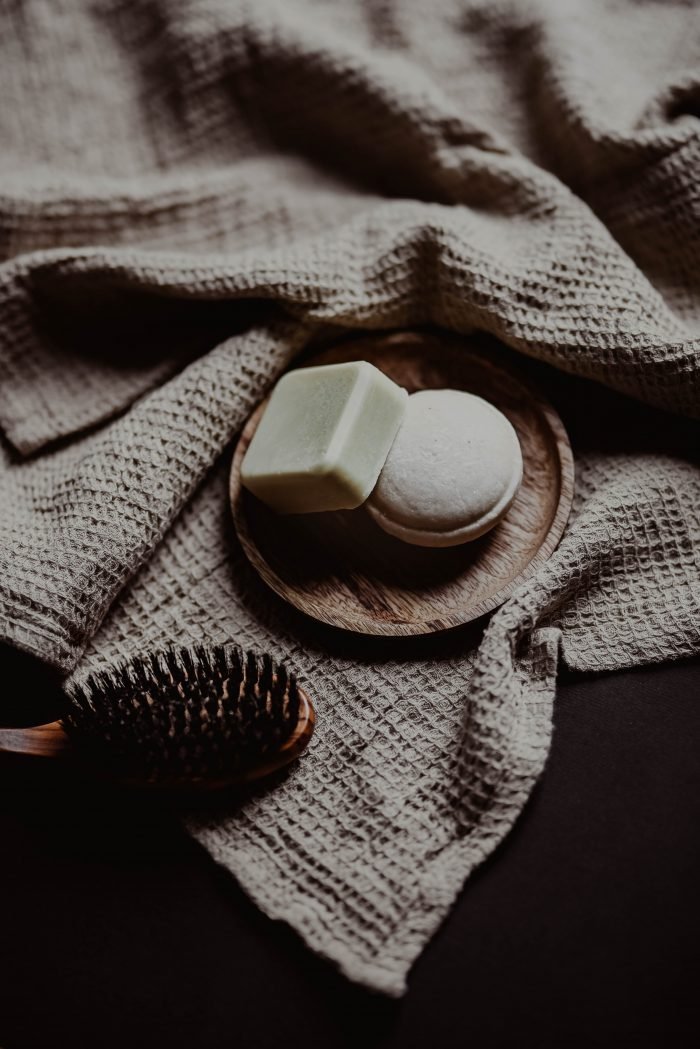 2. Close-up of V.O.H solid shampoo bar on a textured surface, highlighting eco-friendly packaging