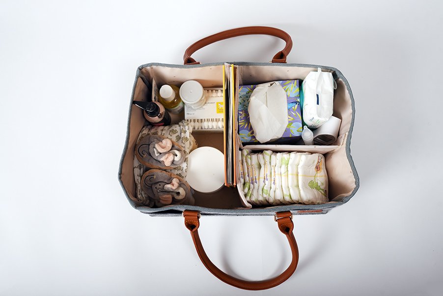 3. Top view of Ally Scandic diaper caddy organizer with multiple compartments and baby items