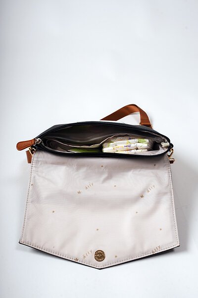 7. Interior view of Ally Scandic Black Coffee handbag, displaying spacious compartment and easy maintenance lining