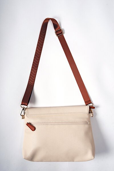 8. Back view of Ally Scandic Älly Handbag in Cappuccino, featuring adjustable strap and zippered pocket