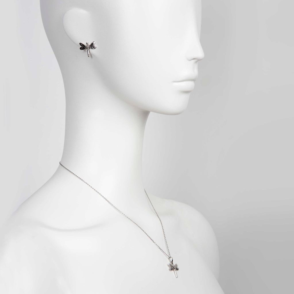 1. Woman wearing Tanel Veenre Dark Dragonfly earrings and matching pendant necklace in rhodium-plated silver