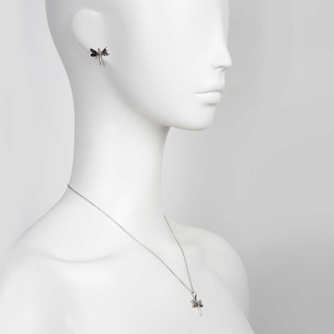 1. Woman wearing Tanel Veenre Dark Dragonfly earrings and matching pendant necklace in rhodium-plated silver