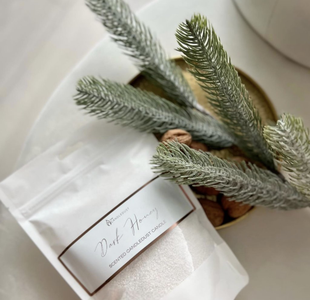 4. Candledust Powdered Candle Refill Kit - Dark Honey with decorative pine branches, showcasing packaging