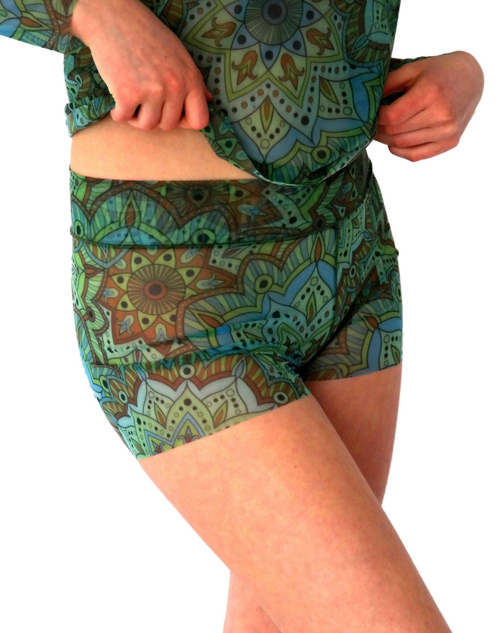 2. Women's green mandala tan-through mini leggings, side view with matching top, highlighting stretchy fit