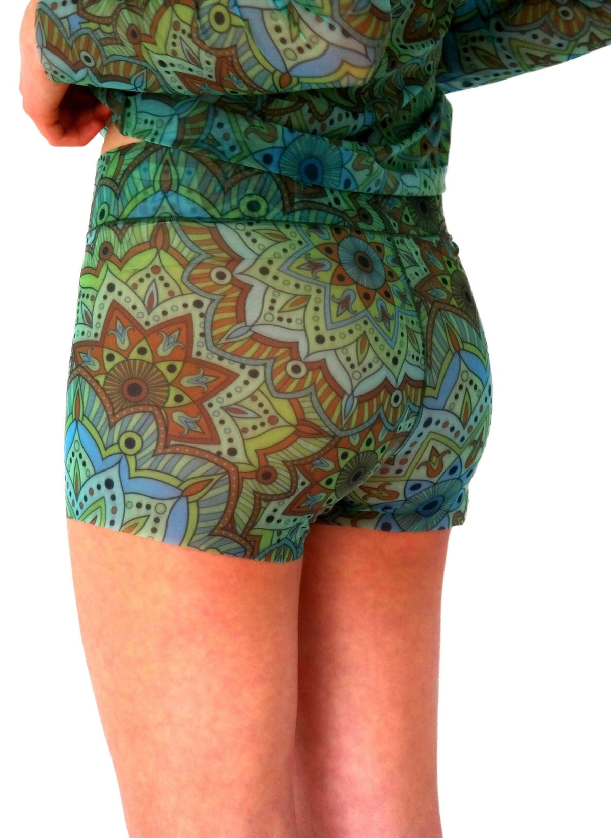 1. Women's tan-through mini leggings in green mandala pattern, shown from the back, paired with matching top