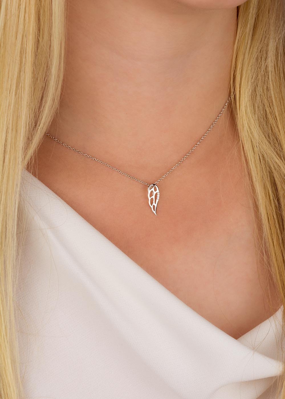 1. Girl wearing Dondella Jewellery Gift Set Wings necklace with rhodium plated sterling silver and zircon stones