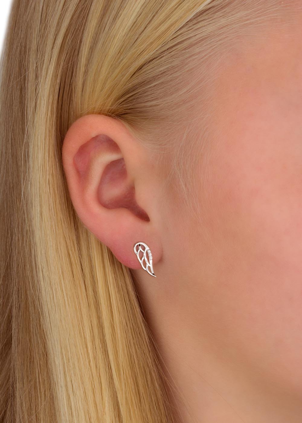 2. Girl wearing Dondella Jewellery Gift Set Wings earrings in rhodium plated sterling silver with zircon stones