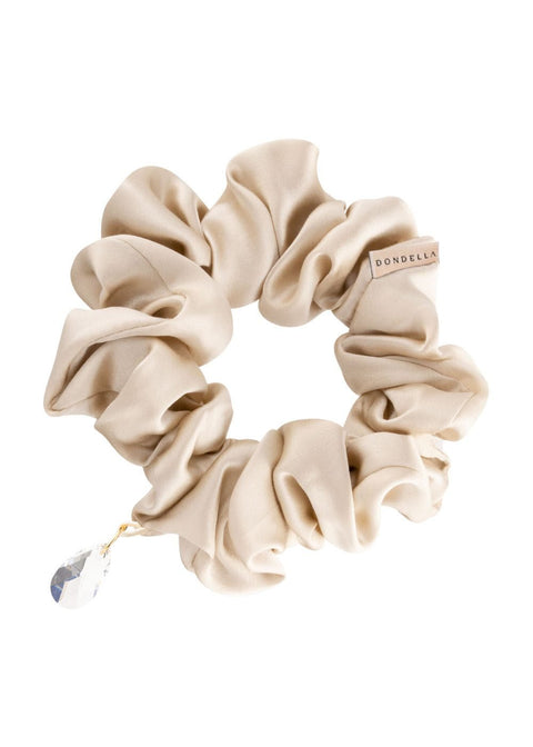 4. Studio shot of Dondella luxury silk scrunchie in beige with crystal charm