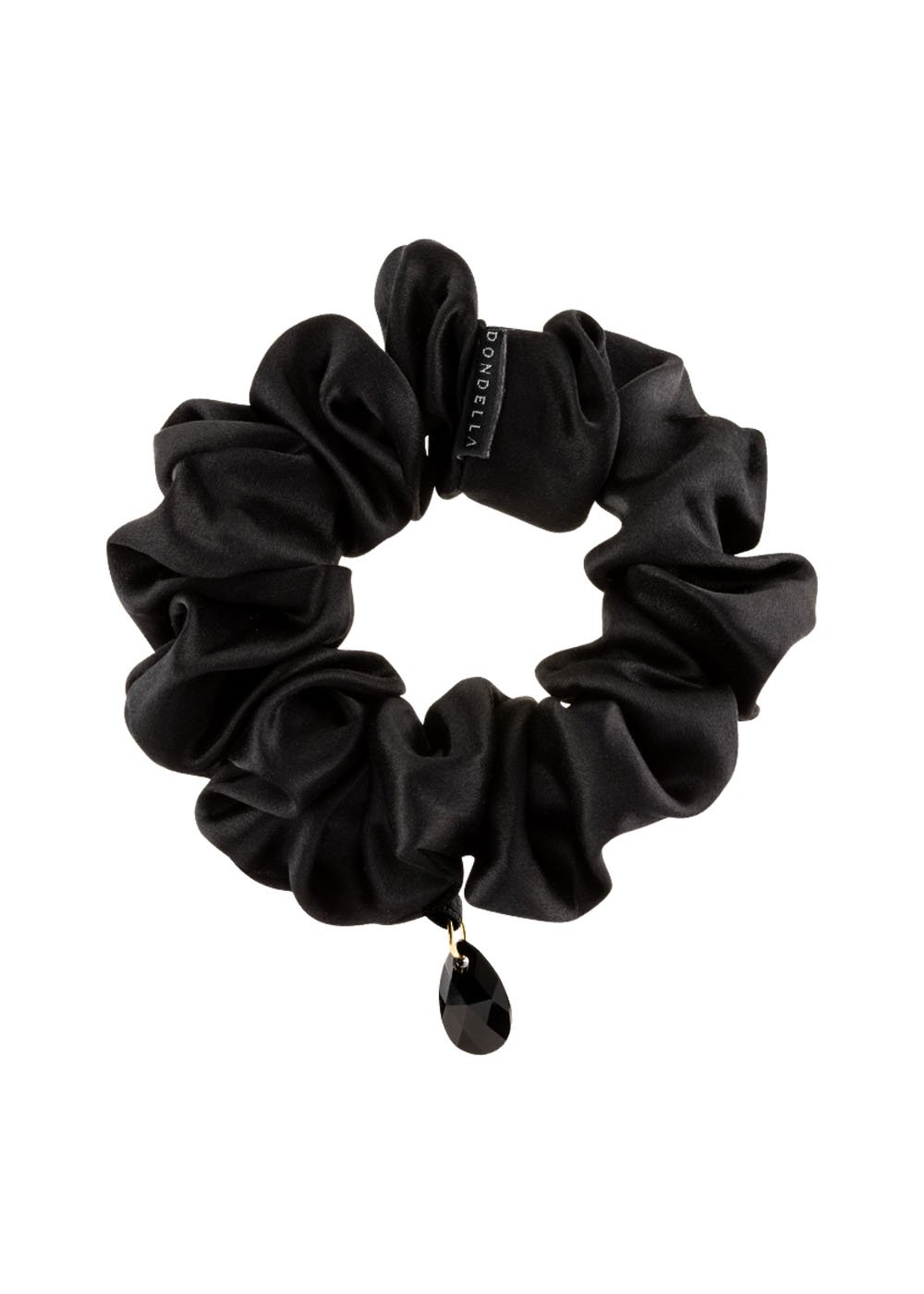 3. Dondella luxury black silk scrunchie with decorative charm, shown in studio setting