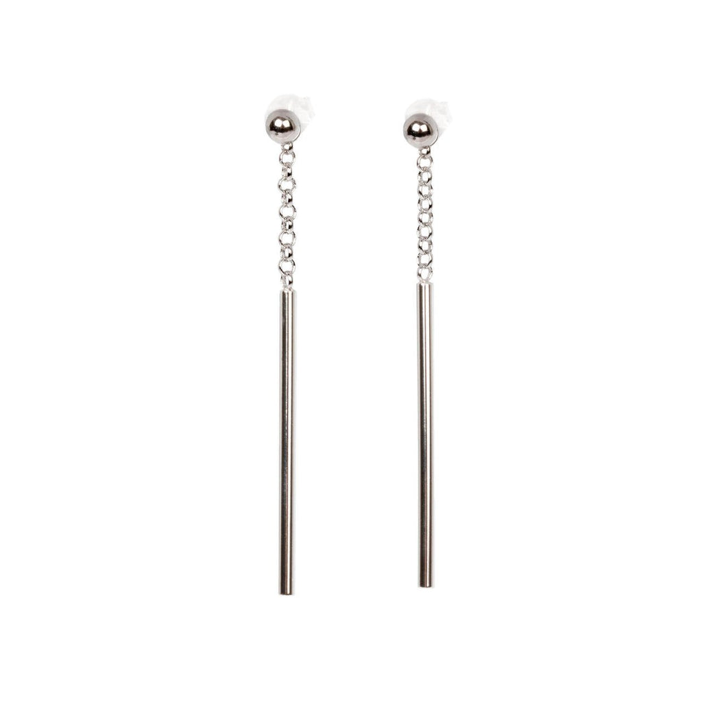 3. Close-up of MyaMoon Dots Falling earrings in sterling silver with chain and bar design on white background