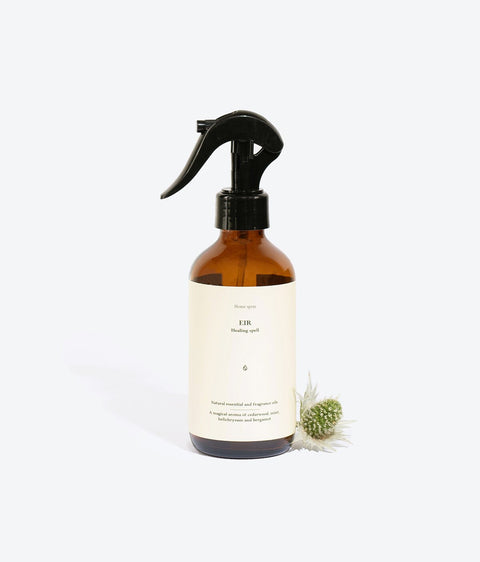 2. Smells Like Spells Perfumed Home Spray EIR with decorative plant, studio setting