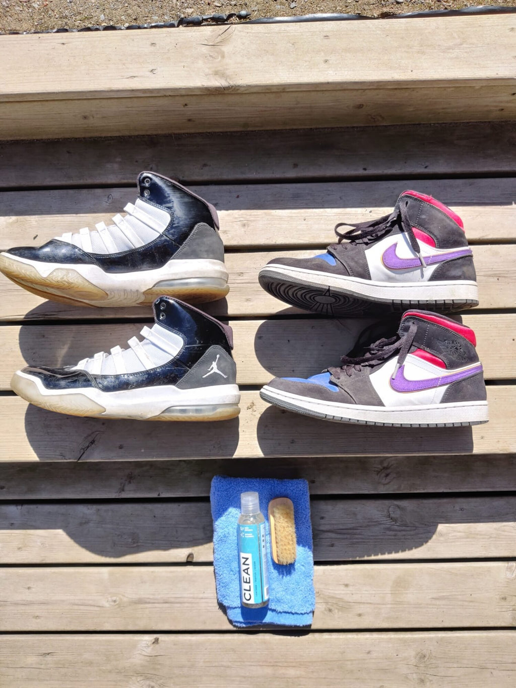 2. GoGoNano shoe cleaner gel with brush and cloth next to various sneakers on wooden surface