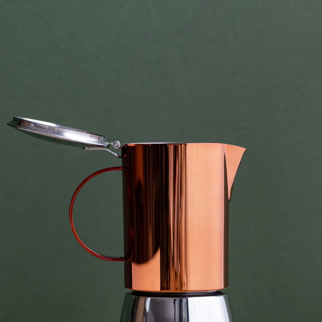 2. La Cafetière copper and silver stovetop coffee maker with open lid on green background
