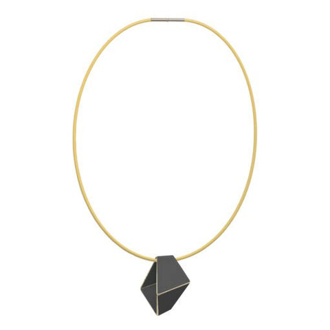 2. Studio image of Lisa Kroeber Jewellery Folded Necklace in black, featuring geometric pendant on brass chain