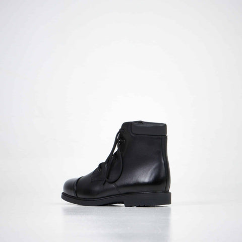 2. Unisex black leather ankle boots by Samelin, alternate side view in studio