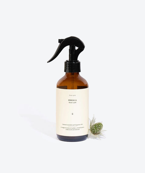 2. Smells Like Spells FRIGGA home spray with decorative plant, studio setting