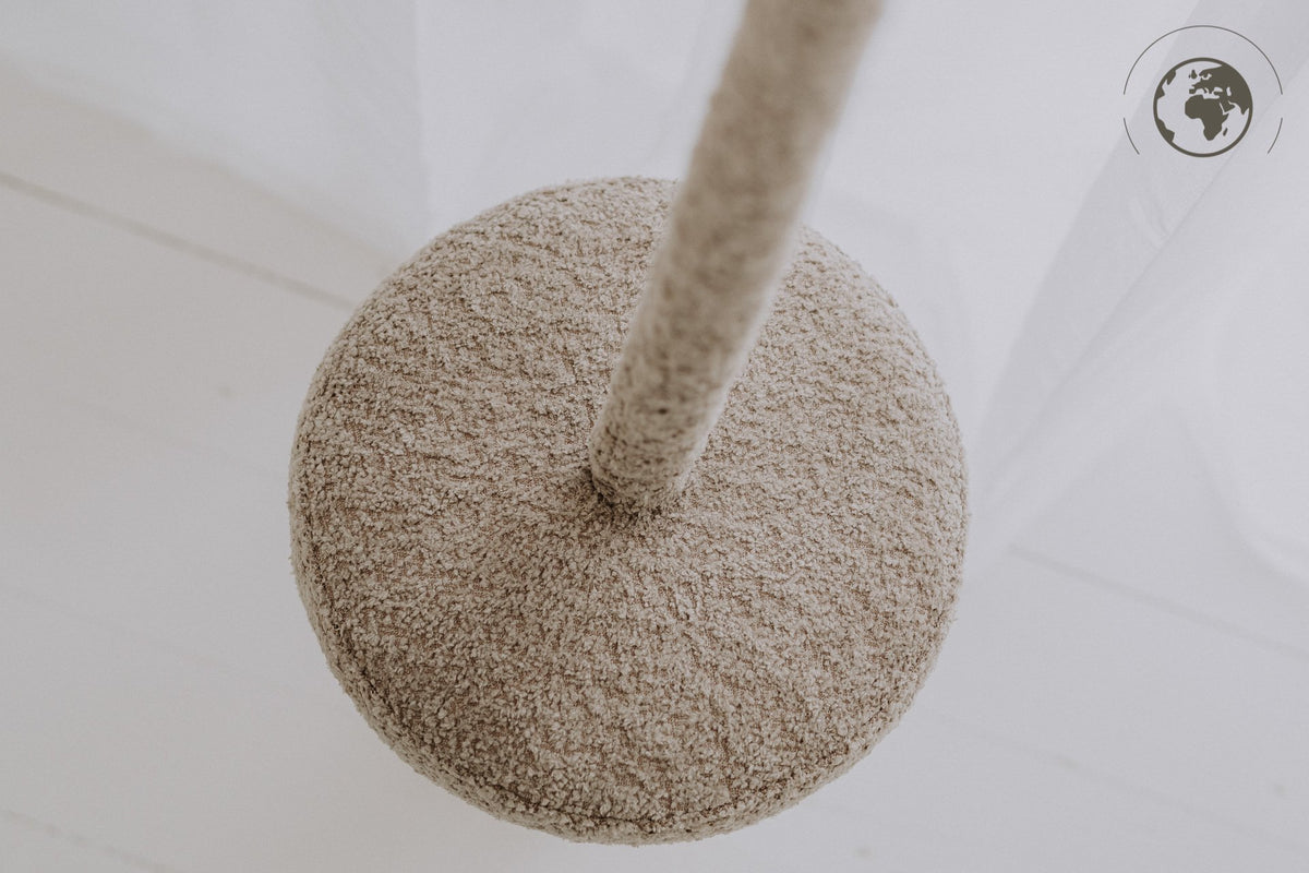 5. Top view of bouclé sand swing seat with cotton rope in bright room