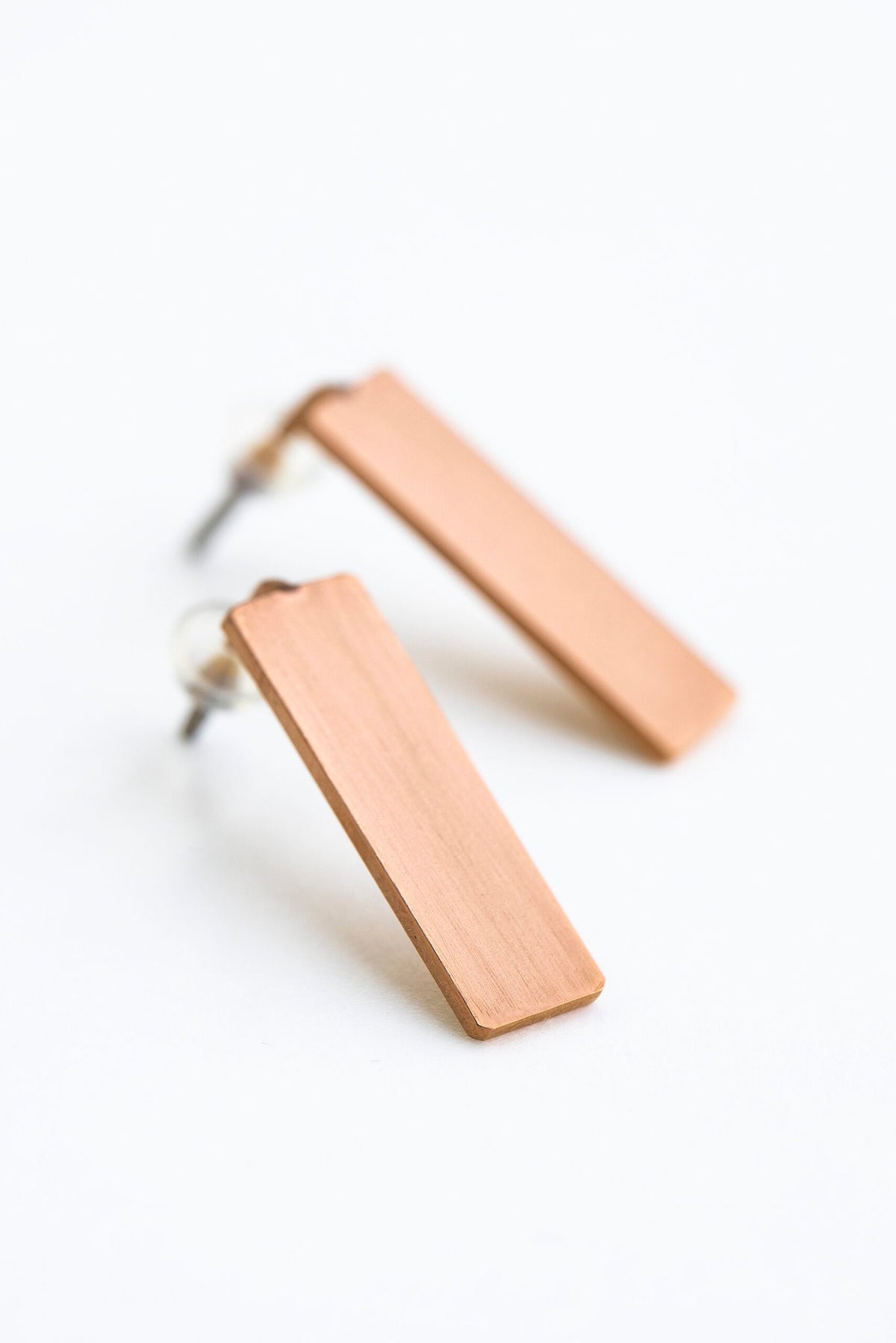 10. Studio shot of Lentsius Corner rose gold earrings, highlighting upcycled industrial materials