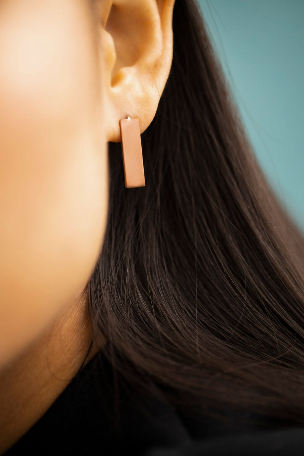 9. Detailed view of Lentsius Corner rose gold earring, showcasing brushed stainless steel finish