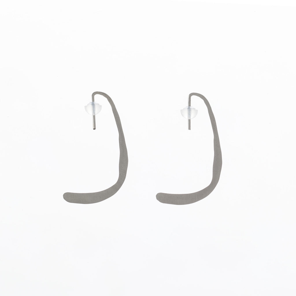 9. Studio image of Lentsius Curvi earrings, showing unique curved design and polished finish