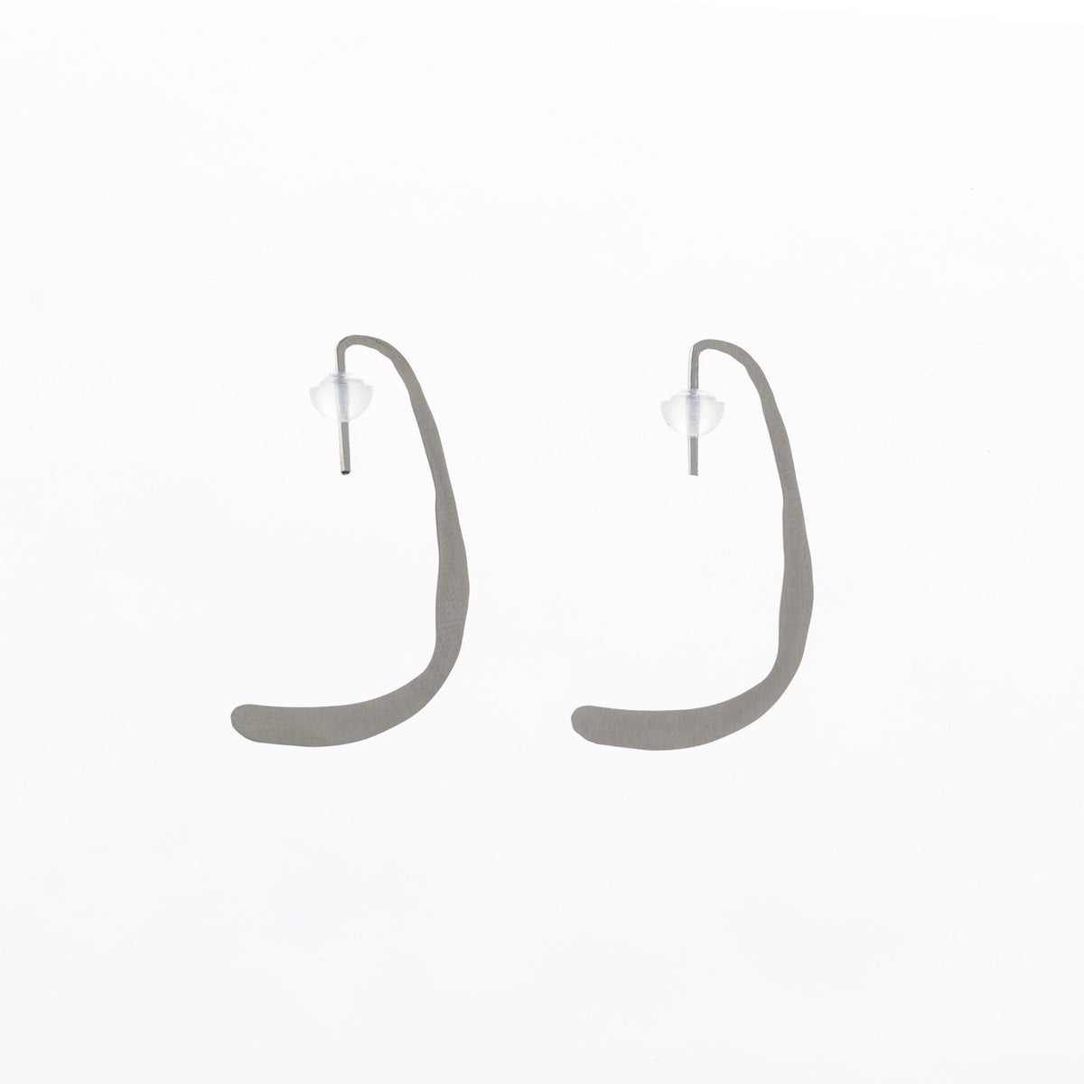 9. Studio image of Lentsius Curvi earrings, showing unique curved design and polished finish