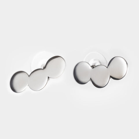 3. Studio shot of Lentsius Baca earrings, featuring upcycled stainless steel with a sleek polished finish