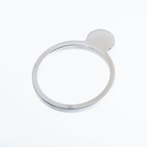 3. Studio shot of Lentsius Cauda ring in stainless steel, showing unique modern design and sustainable craftsmanship
