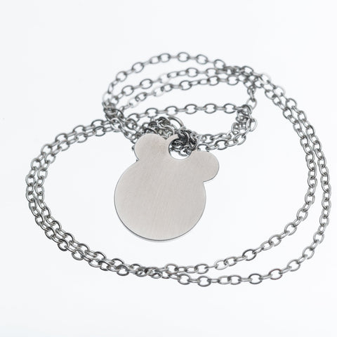 3. Studio shot of Ursa necklace by Lentsius with brushed stainless steel pendant