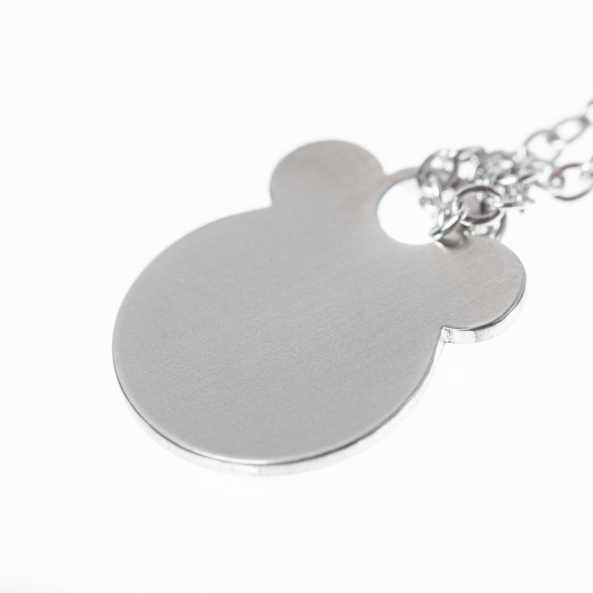 4. Close-up of Ursa necklace pendant by Lentsius in brushed stainless steel