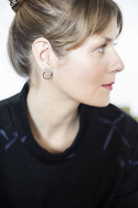 4. Side view of woman with Lentsius Luna earrings, showing half-matte finish