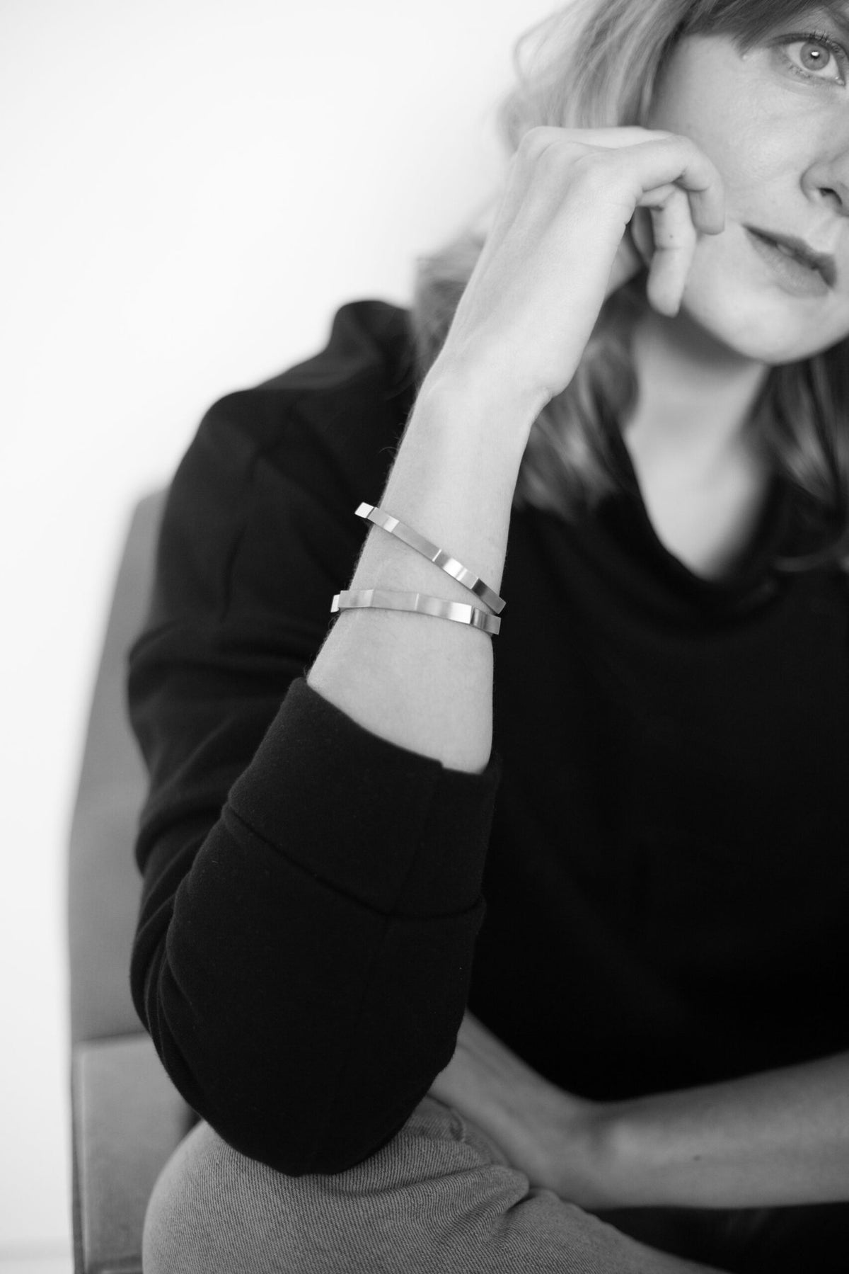 3. Close-up of woman wearing Lentsius Solis bracelet, emphasizing sustainable design