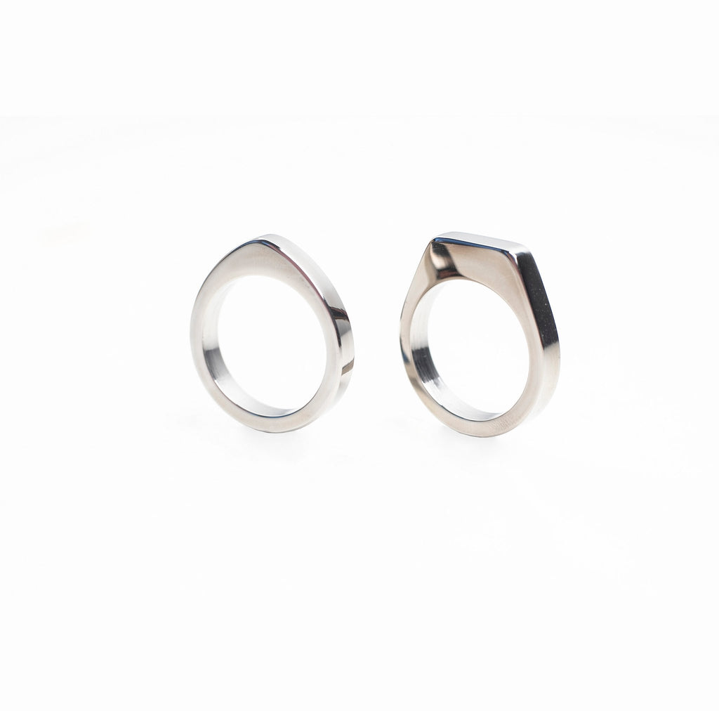 5. Studio image of Lentsius Twins rings in stainless steel, showing unique design