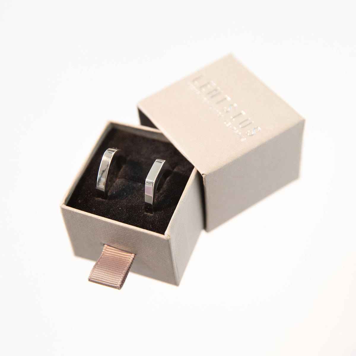 3. Lentsius Twins rings in stainless steel displayed in branded box