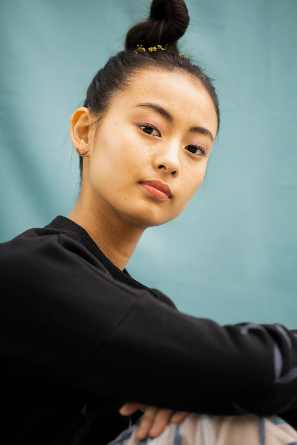 6. Woman wearing Lentsius Vola rose gold earrings, emphasizing timeless elegance