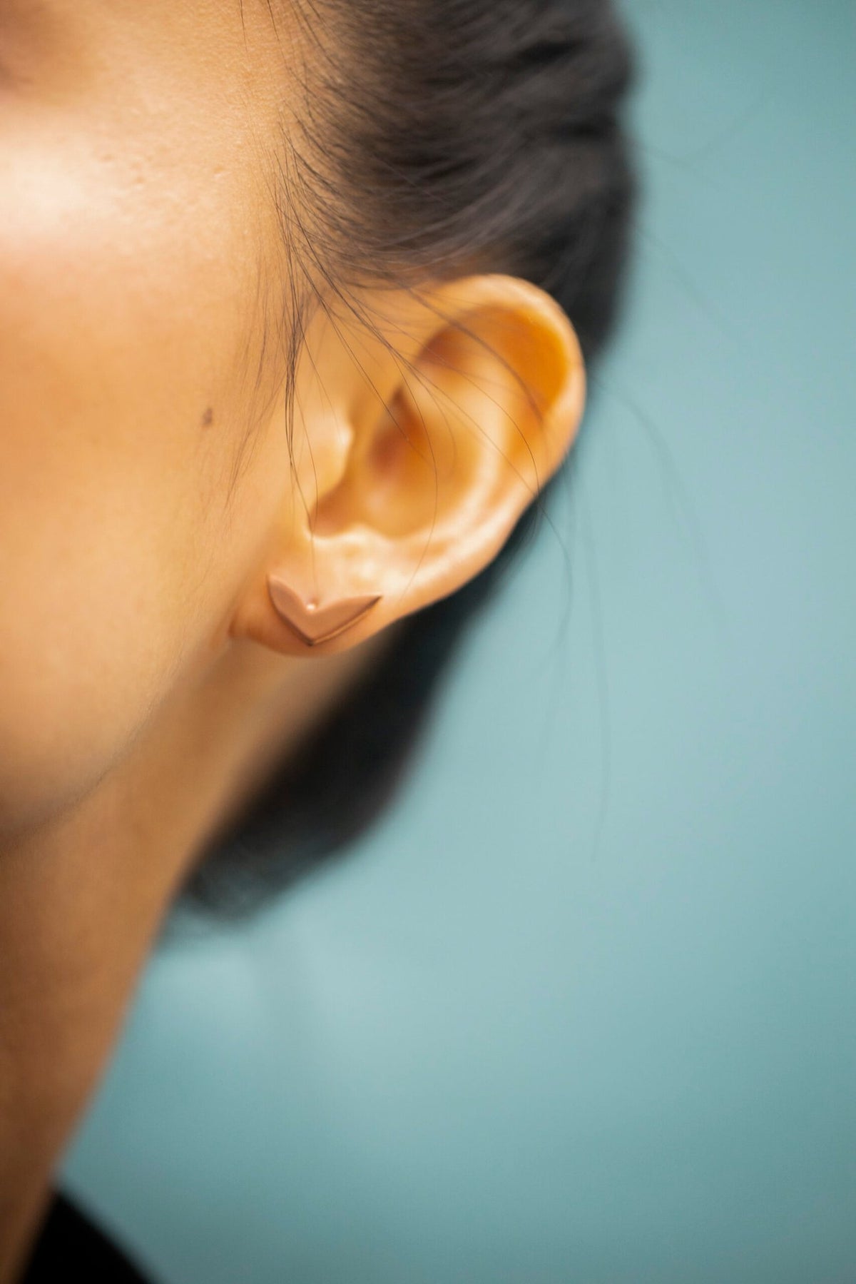 9. Close-up of Lentsius Vola rose gold earring, highlighting PVD TiCN coating and design