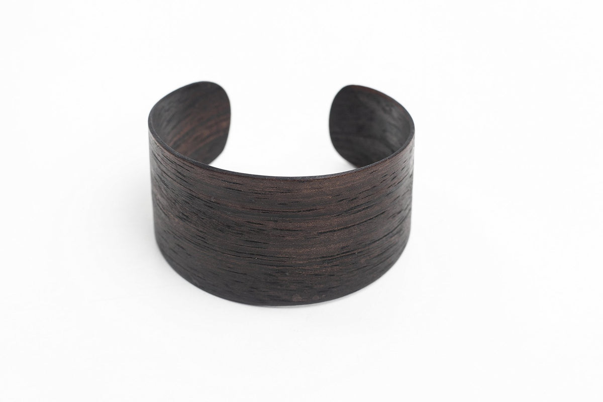 1. Lentsius Woody Bracelet in Ebony, handmade from natural ebony veneer, shown in studio setting