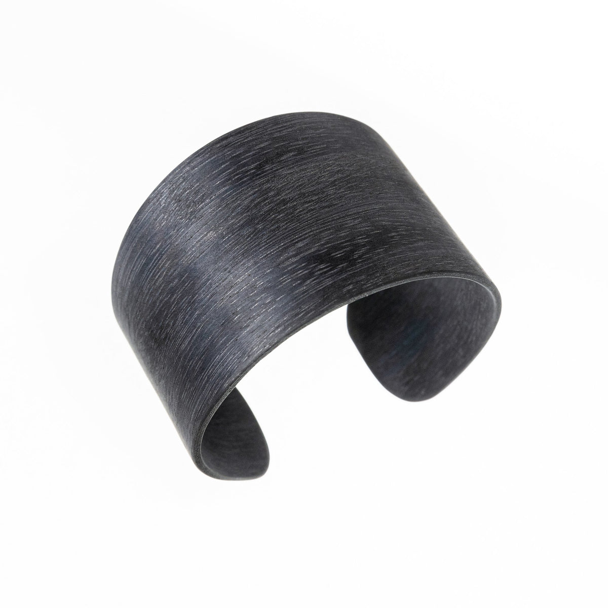 1. Lentsius Woody Bracelet in Eucalypt Grey, handmade with upcycled metal and wood, shown in studio setting