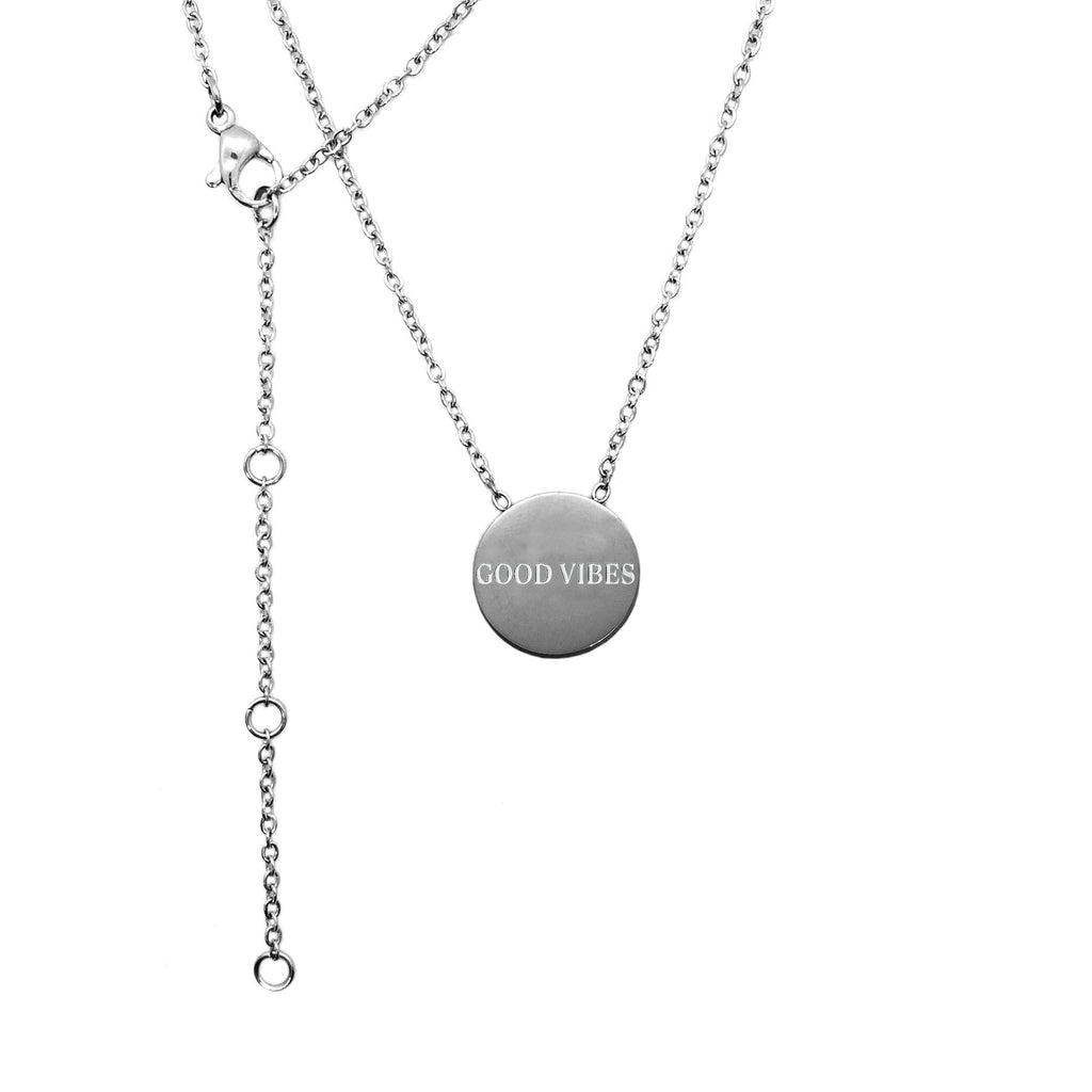 3. Studio image of Olla's Good Vibes necklace in silver with engraved medallion