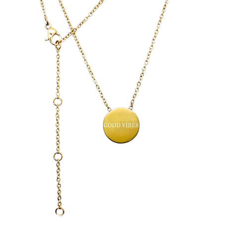 4. Studio image of Olla's Good Vibes necklace in gold with engraved medallion