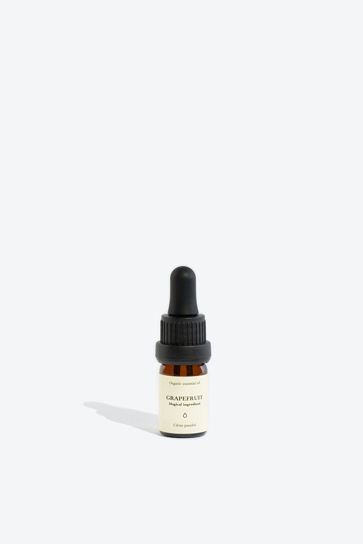 1. Smells Like Spells Grapefruit Essential Oil in 5 ml glass bottle with pipette, studio shot