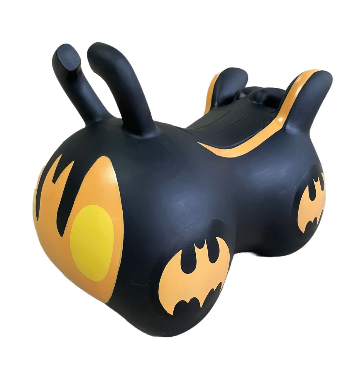 3. Black and yellow JUMPY Batmobile toy with bat design on white background