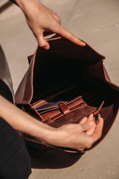 3. Inside view of brown leather knapsack showing modular pocket system