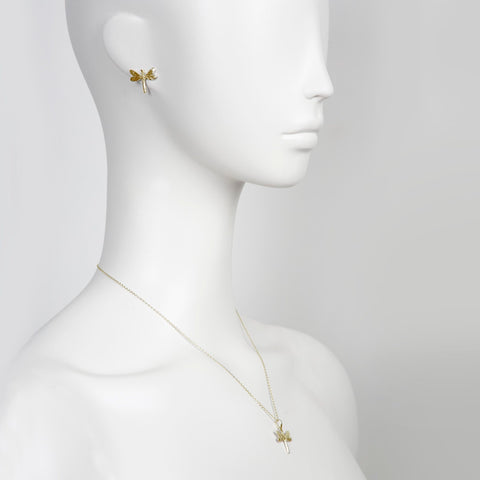 1. Woman wearing gold dragonfly earrings and matching necklace on a mannequin, showcasing elegant design and size